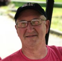 man in a red shirt and glasses